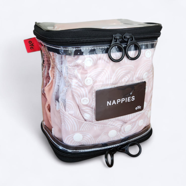 OUT YNDR CLUB wet clothes pod with zipper top and bottom, front angle view packed with four modern cloth nappies