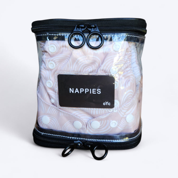 OUT YNDR CLUB wet clothes pod with zipper top and bottom, front view packed with four modern cloth nappies econaps mcn