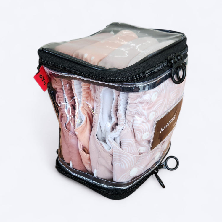 OUT YNDR CLUB wet clothes pod with zipper top and bottom, side angle view packed with four modern cloth nappies econaps mcn