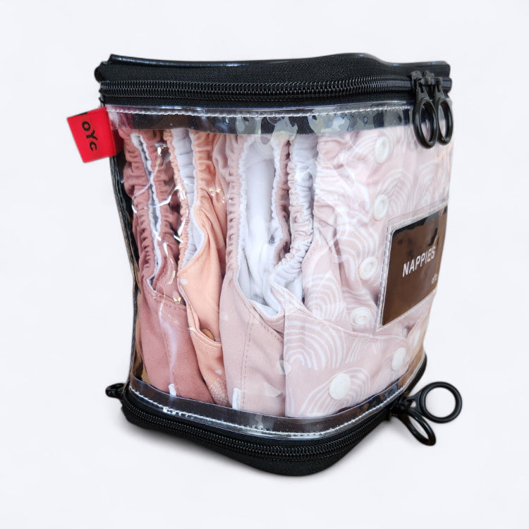 OUT YNDR CLUB wet clothes pod with zipper top and bottom, side view closed OYC packed with four modern cloth nappies econaps