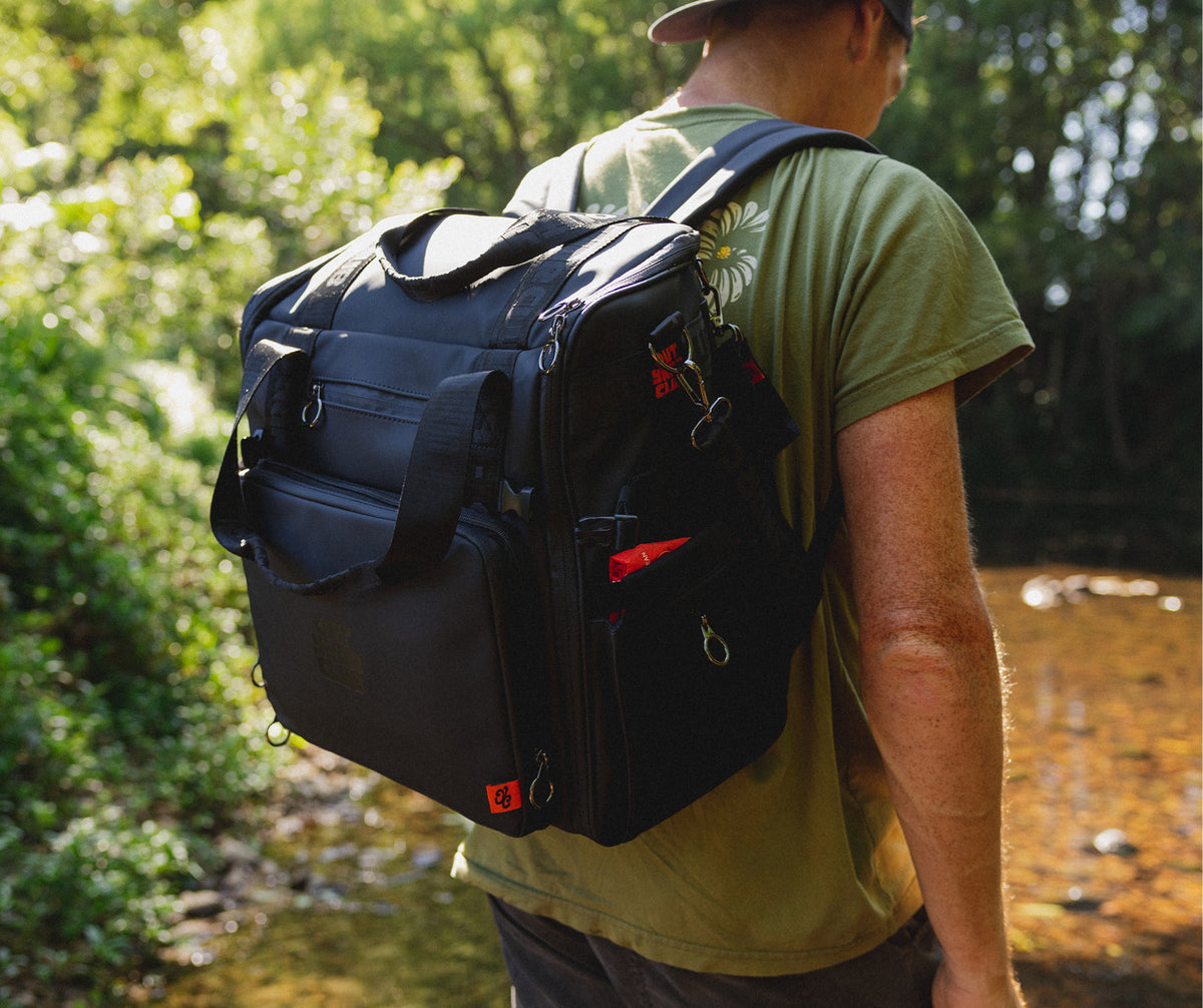 Parent packing an organised Medley nappy backpack