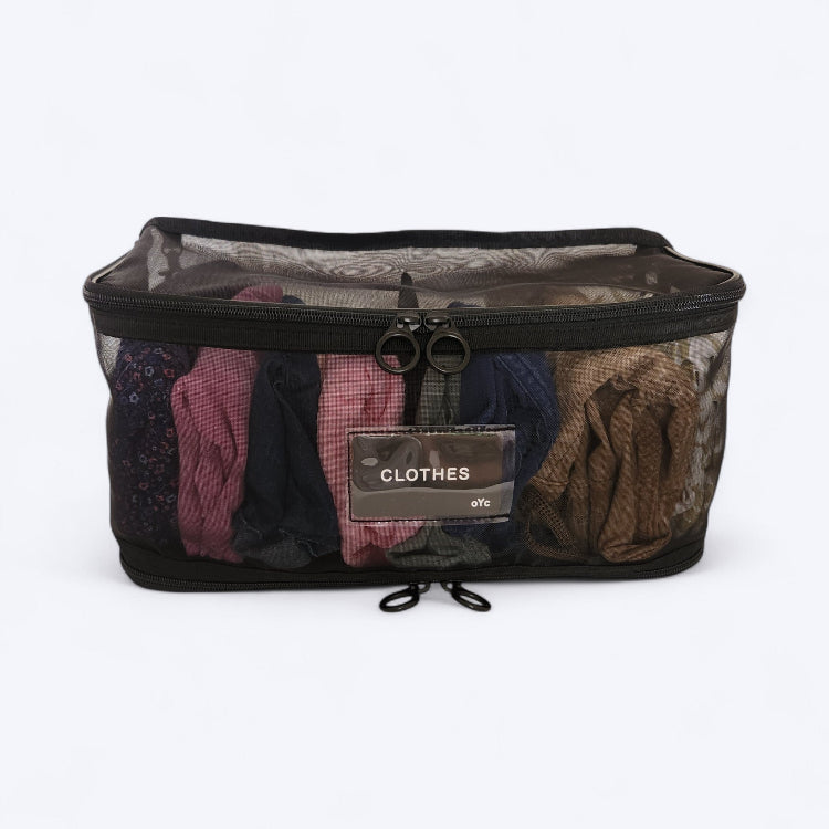 OUT YNDR CLUB Medley nappy bag bag pocket compartment, black mesh pod, front view filled with clothes and labelled