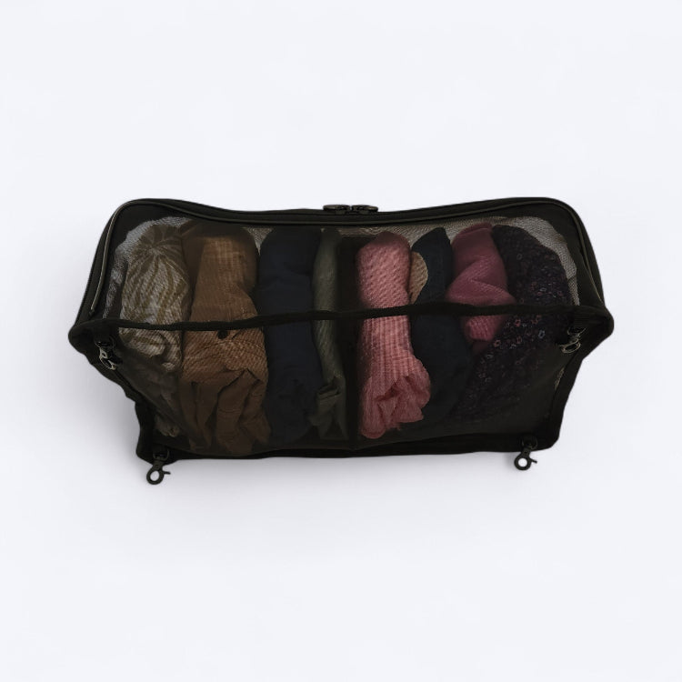 OUT YNDR CLUB Medley baby bag, black mesh pod, back view filled with children's clothes