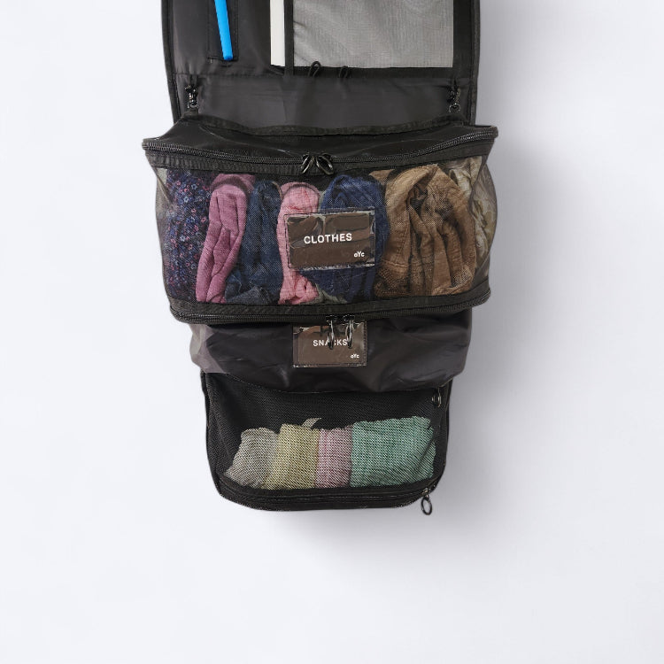 OUT YNDR CLUB Medley nappy bag bag pocket compartment, black mesh pod, front view. hanging inside hanging organiser backpack