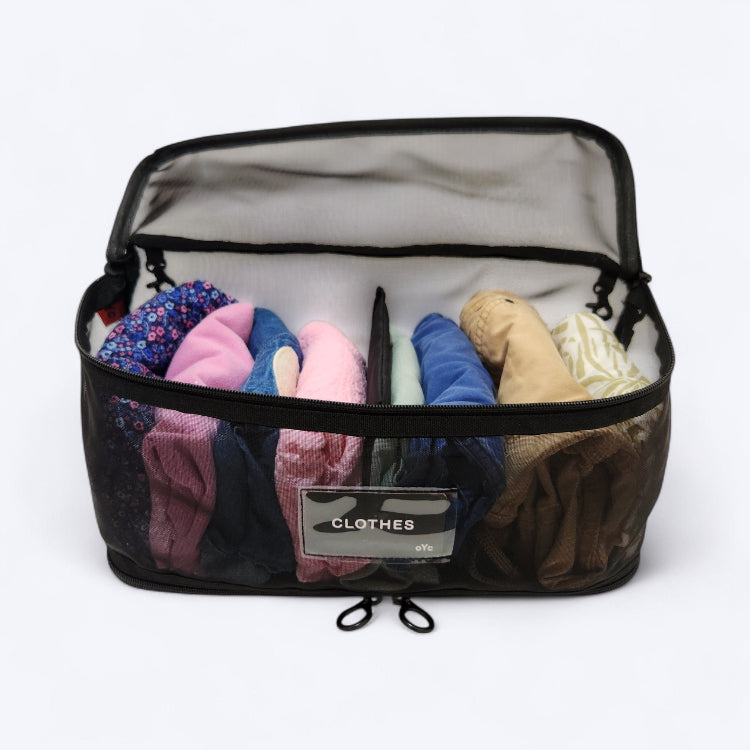 OUT YNDR CLUB Medley baby bag, black mesh pod, front top view, open filled with children's clothes
