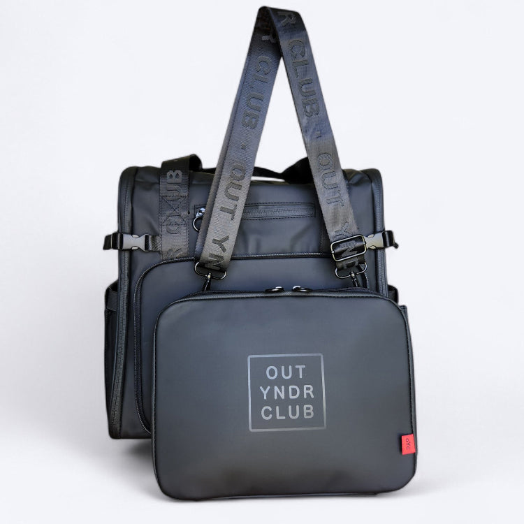 OUT YNDR CLUB Medley baby bag with detachable handbag and compact nappy bag for parents with newborn baby, black front view with separated handbag.