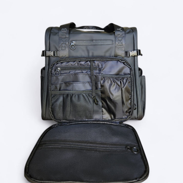 OUT YNDR CLUB Medley baby bag for parents with newborns and young children, black front view with pocket open