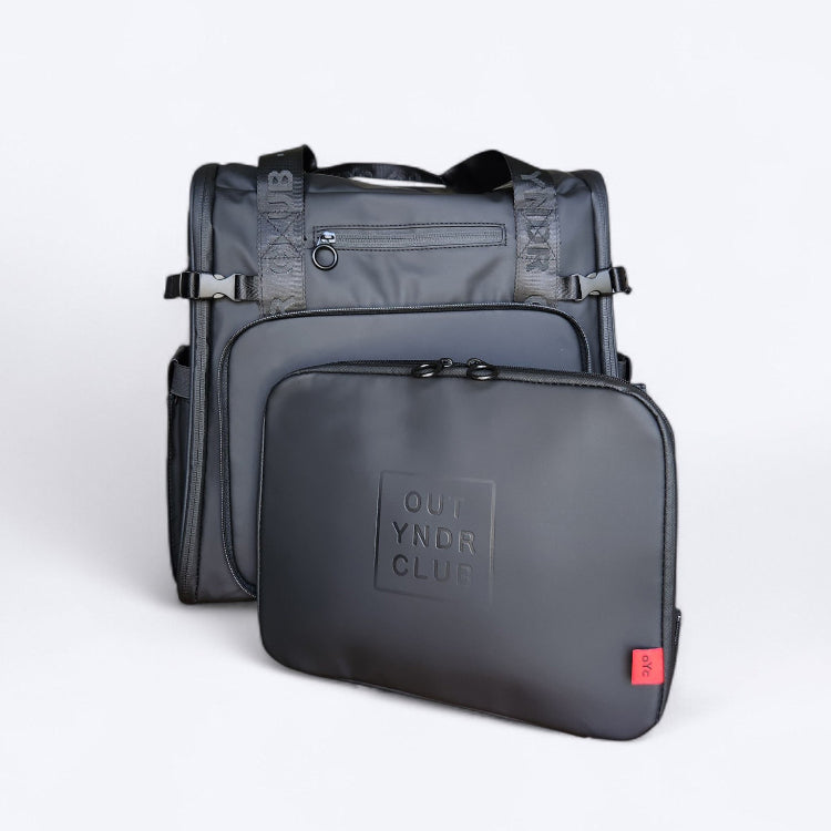 OUT YNDR CLUB Medley nappy backpack with detachable handbag and compact nappy bag for parents with newborn baby, black front view with separated handbag.